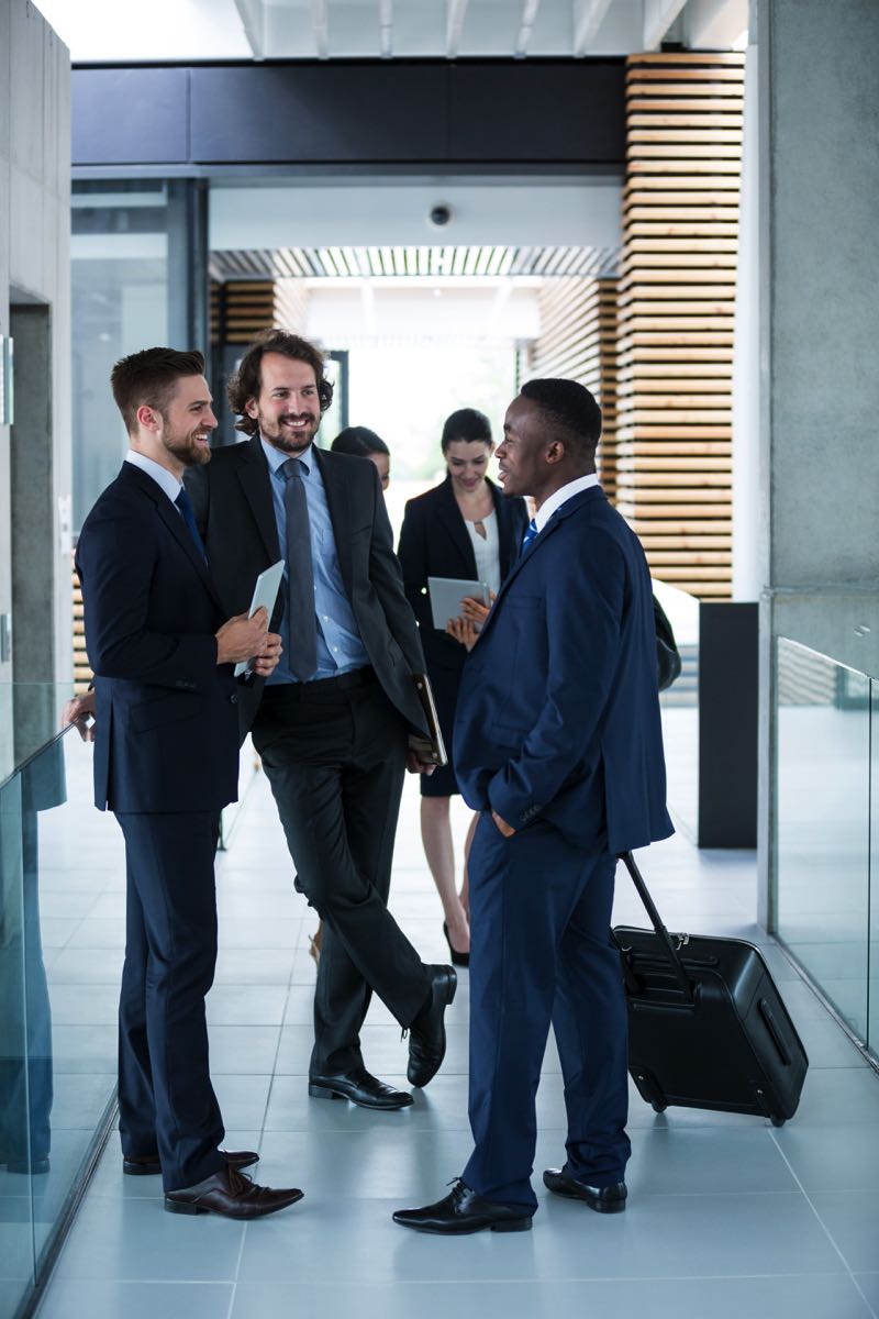 businessmen-having-a-conversation-2HWKRLQ-1