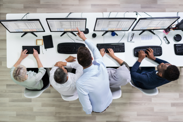 Team analyzing workflow processes to improve operational efficiency
