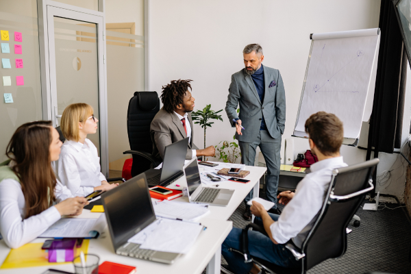 Business leader delegating responsibilities through optimized systems