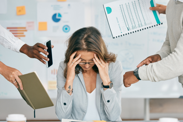 Overworked employees experiencing burnout due to inefficient business processes